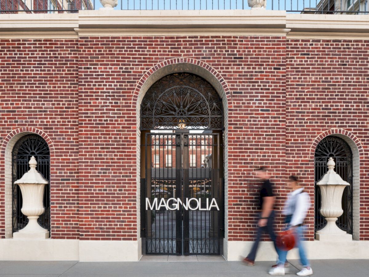 A brick building with a gated entrance labeled 